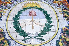 11-11 Tiled Image In Mendoza Plaza Espana of The Coat Of Ams Of Argentina The Sun Overlooking Two Hands Shaking.jpg